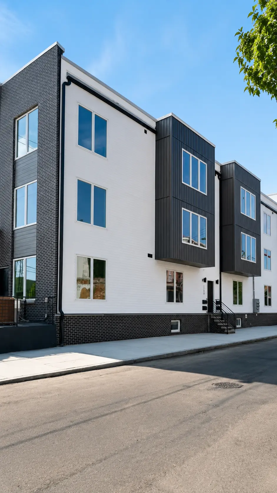 Modern black and white townhome exterior on a quiet Philadelphia street